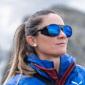 Woman wearing Smith glacier sunglasses with blue mirrored lenses