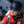 Person wearing a Smith helmet and blue sunglasses with a North Face jacket on a snowy mountain