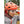 Person wearing a Smith Optics orange cycling helmet and white clear lens glasses