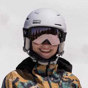 Person wearing a white Smith Optics helmet and mirrored goggles