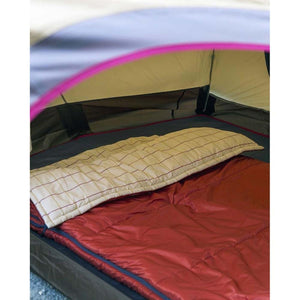 Red sleeping bag with a cream and red plaid pillow inside a camping tent