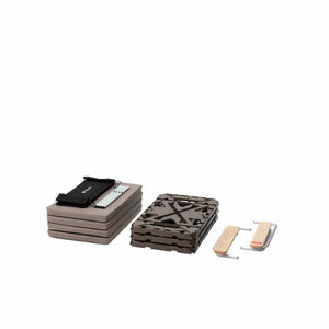 Snow Peak folded camping furniture components including table parts and storage bag
