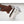 Hand in brown leather glove holding a stainless steel Snow Peak coffee percolator