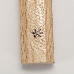 Snow Peak logo branded on a textured wooden handle
