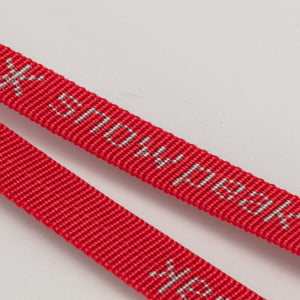 Red nylon webbing strap with silver Snow Peak logo text