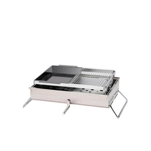 Portable stainless steel camping grill with a flat griddle and wire cooking grate