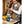 Person pouring water from a Snow Peak kettle into a coffee dripper on a table