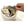 Hand placing a metal coffee dripper into a canvas drawstring storage bag