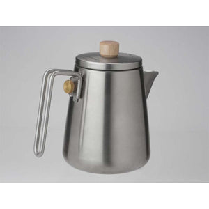 Snow Peak stainless steel kettle with wooden lid knob and brass handle detail
