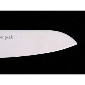 Close up of a Snow Peak knife blade with brand logo