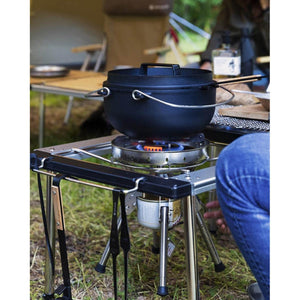 Snow Peak cast iron dutch oven cooking on a portable camping stove