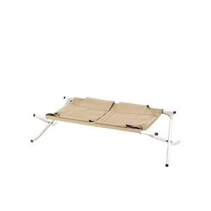 Snow Peak beige folding camping cot with white metal frame
