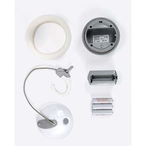 Disassembled Snow Peak Hozuki lantern components including battery pack and batteries