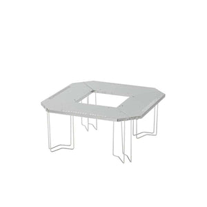 Snow Peak stainless steel folding camping table with a square center cutout