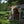 Snow Peak tent with extended canopy and outdoor dining set on a grassy field