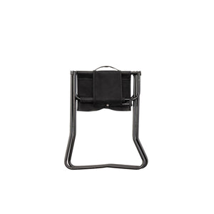 Snow Peak black folding stool in a closed position