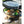 Snow Peak cast iron pot with lid lifted to reveal cooked vegetables and sausages