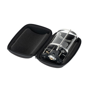 Portable camping stove inside a black protective zippered carrying case