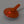 Orange Snow Peak lantern with a glowing red light