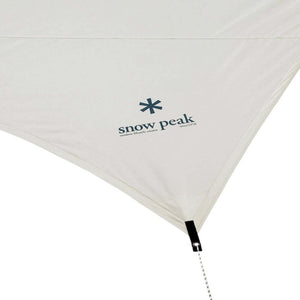 Snow Peak logo printed on a beige fabric tarp corner with a guy line attachment