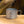 Snow Peak titanium 450 double wall mug with folding handle on wooden surface