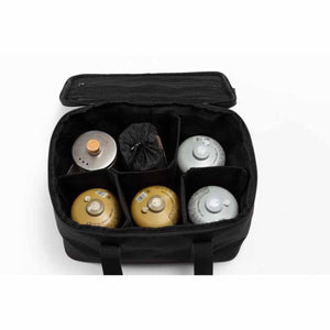 Snow Peak black storage bag with internal dividers holding camping fuel canisters and gear