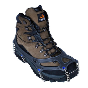 Snowline traction cleats attached to a brown leather hiking boot