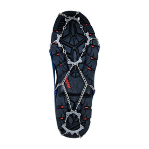 Snowline traction spikes attached to the sole of a hiking boot