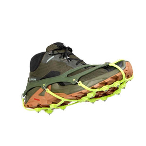 Snowline traction spikes attached to a hiking boot