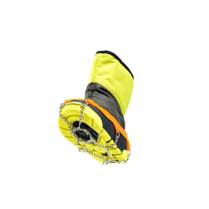 Yellow and grey winter boot with metal ice traction cleats attached to the sole