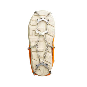Orange shoe with metal ice traction cleats attached to the sole