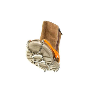 Brown suede boot with orange rubber and metal chain traction cleats attached to the sole