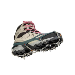 Hiking boot with metal traction spikes attached to the sole