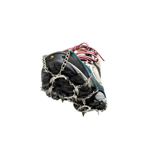 Hiking boot with metal traction spikes attached to the sole
