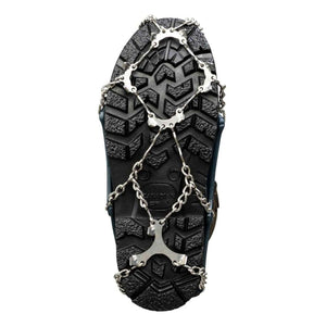 Snowline traction cleats attached to the sole of a black boot
