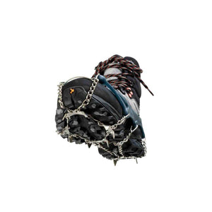 Snowline traction spikes attached to a hiking boot