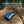 Ocoopa hand warmer on a wet rock during rain