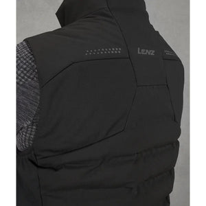 Back view of a black Lenz vest with reflective dot detailing