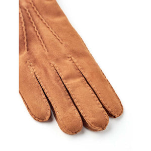 Hestra tan suede gloves with visible stitching details