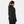 Woman wearing a black Helly Hansen hooded jacket viewed from the back