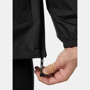 Hand adjusting the drawstring hem on a black Helly Hansen jacket