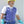 Worker wearing a TechKewl blue cooling vest with a yellow hard hat and safety glasses