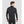 Man wearing a black long sleeve mock neck base layer shirt from the back