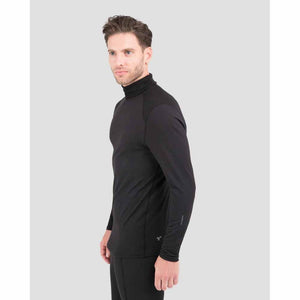 Man wearing a black long sleeve mock neck base layer top