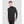 Man wearing a black long sleeve mock neck thermal base layer top