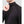 Man wearing a black long sleeve mock neck shirt with ribbed shoulder panels