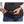 Person plugging a Therm-ic power bank into a heated vest pocket