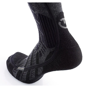 Black and grey Thermic heated sock on a foot