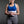 Person wearing a white ThermApparel cooling vest over a blue sports bra