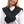 Person wearing a black Thermup heated neck wrap over a white sweater